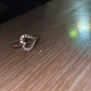 Gold ring with jewels shaped as a heart